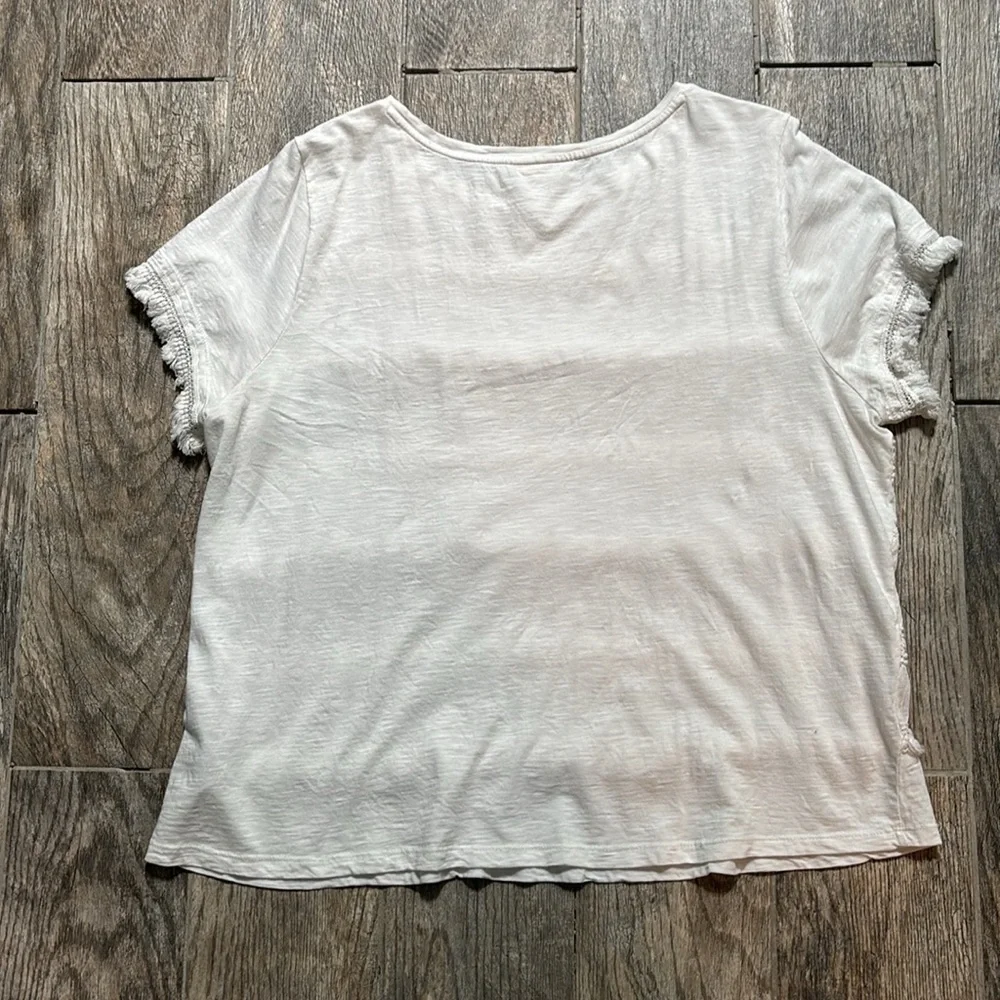 Style & Co white tee with stripes of fringe and crochet